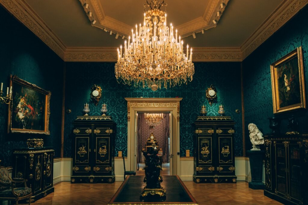 Luxurious vintage room featuring an ornate chandelier and classic furnishings in a Vienna palace.